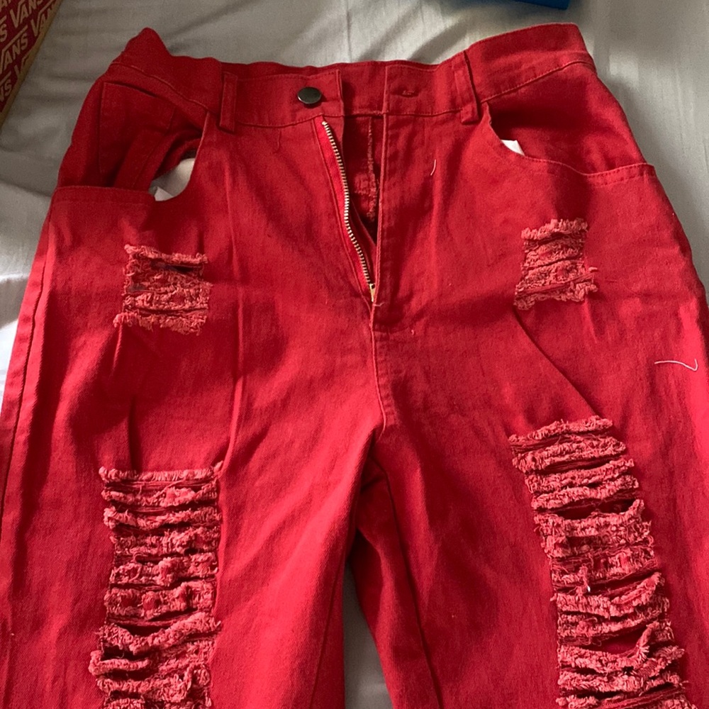 Red denim jeans w flare at bottom